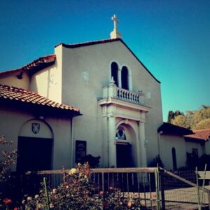 front of a white spanish-style church