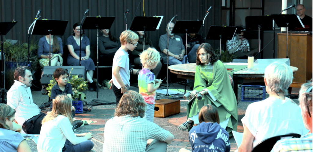 Rector and children in the courtyard