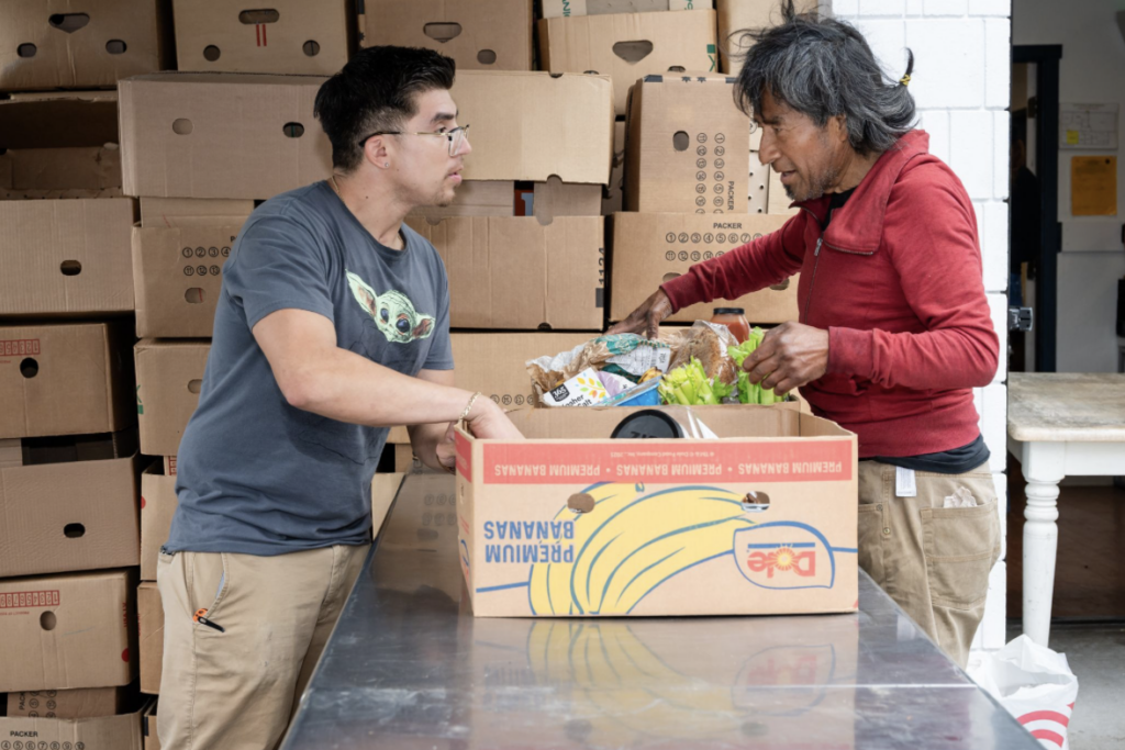 Two men with groceries