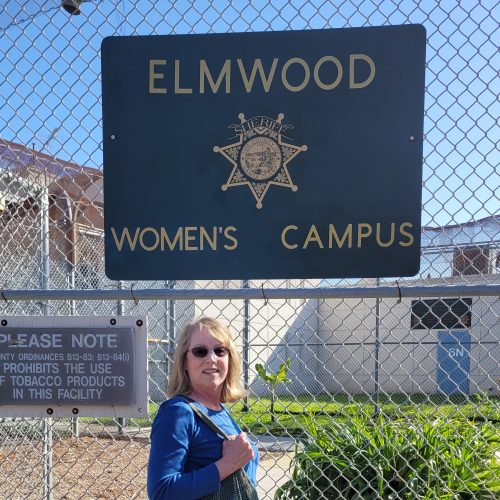 A volunteer chaplain standing in front of Elmwood women's jail