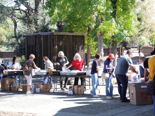 People creating hygiene kits for unhoused neighbors