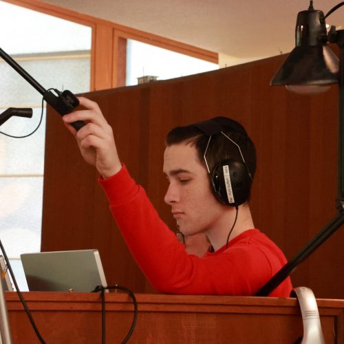 A teenager running the sound and video for Sunday services