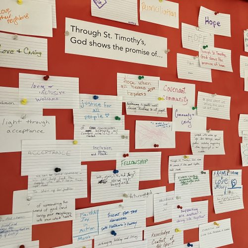 A bulletin board with index cards showing how God fulfills promises through St. Tim's